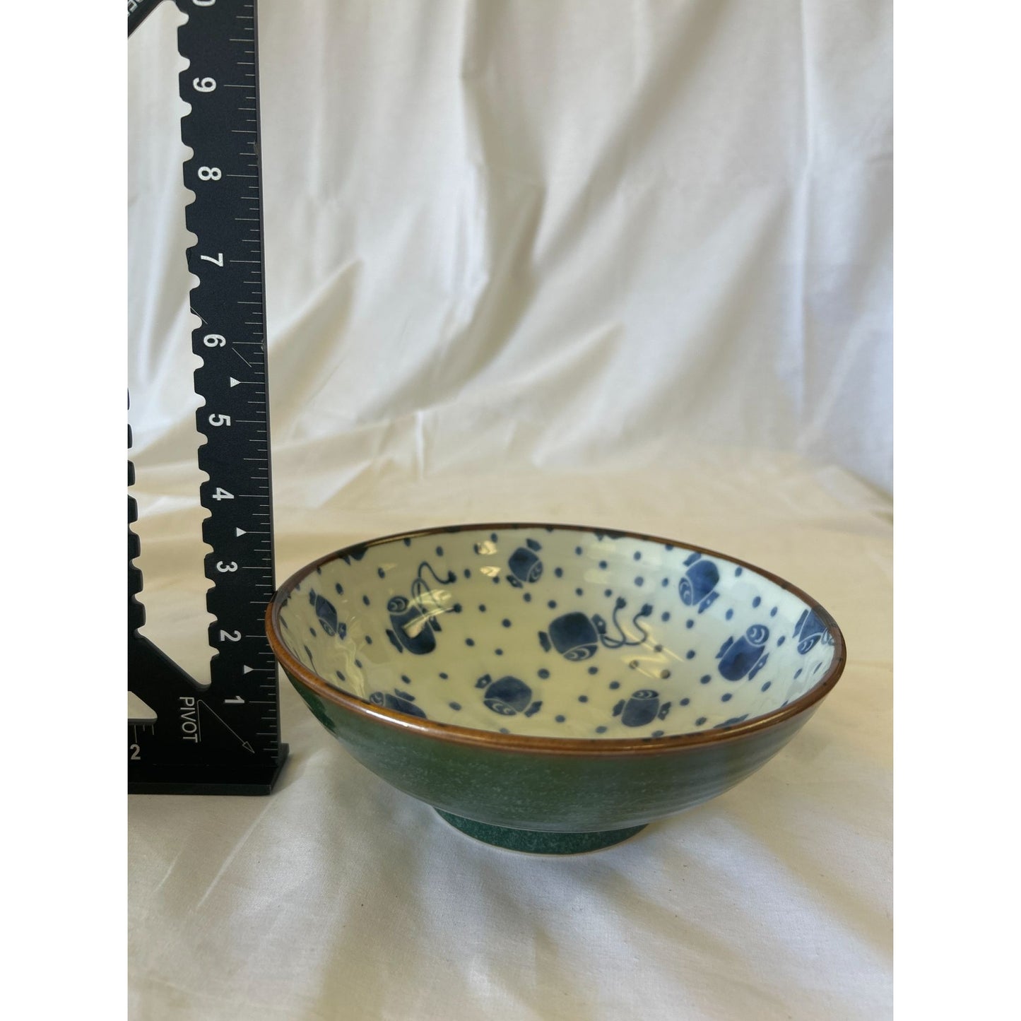 Handcrafted Ceramic Bowl With Blue Fish Print & Green Exterior