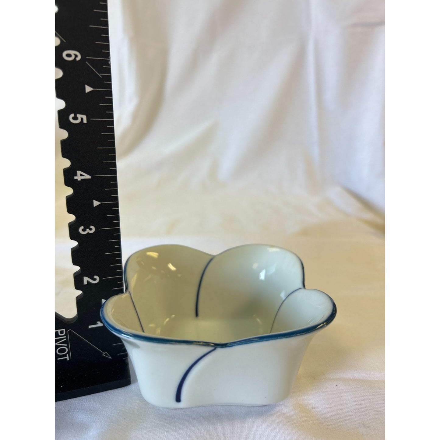Small White Ceramic Flower-Shaped Bowl With Blue Rim & Accents