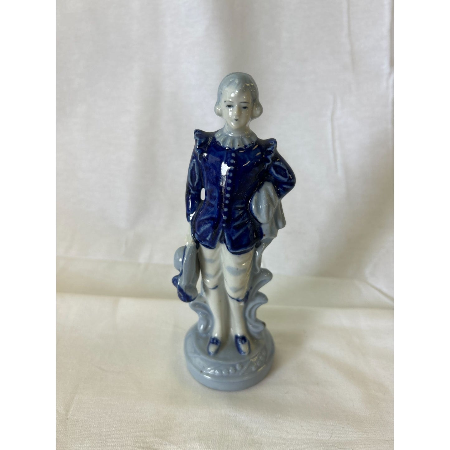 Vintage Porcelain Figurine Of Boy In Blue Coat Holding Hat & Scroll