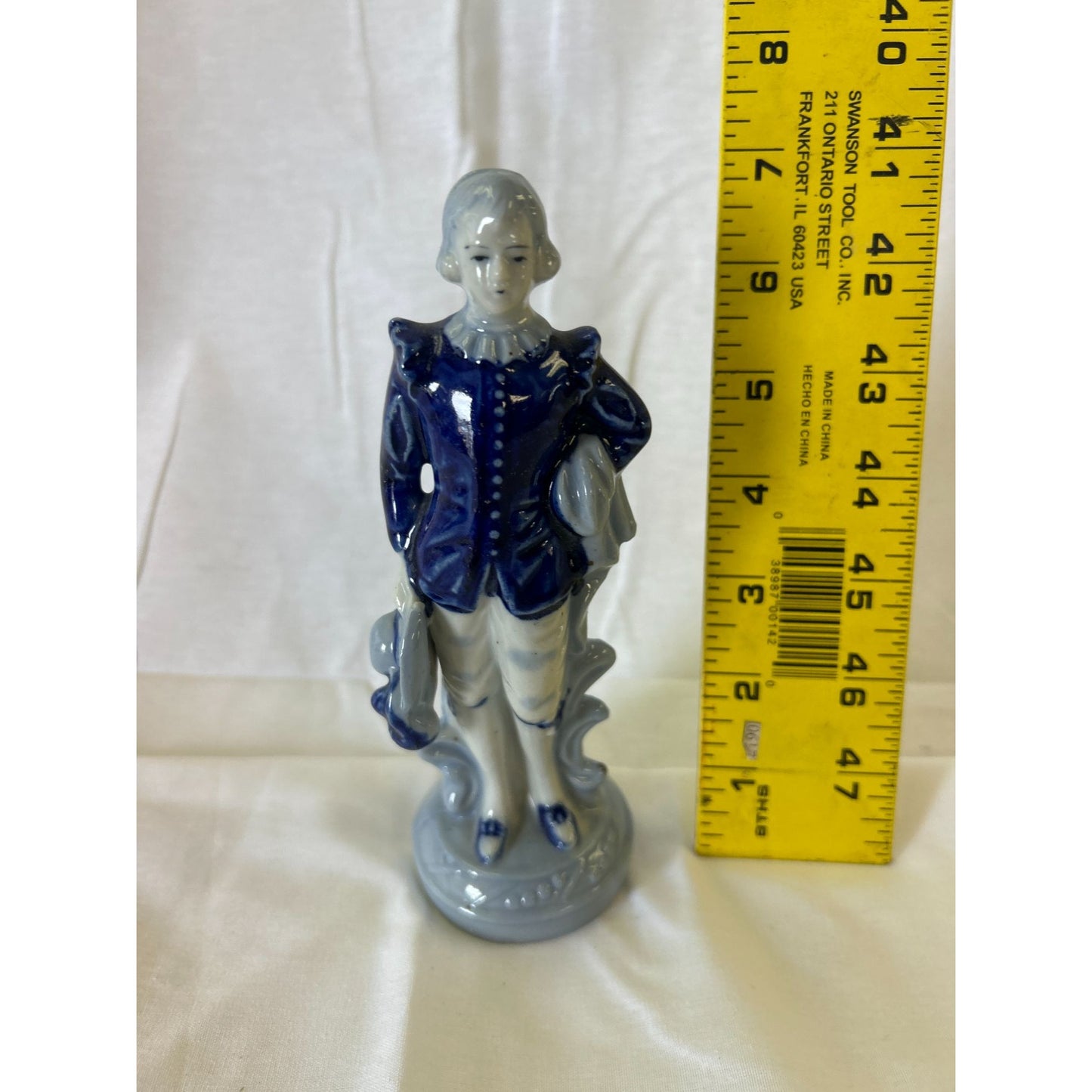 Vintage Porcelain Figurine Of Boy In Blue Coat Holding Hat & Scroll