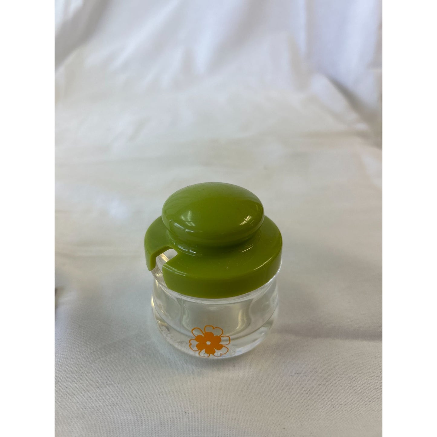 Mini Clear Glass Container With Green Lid & Orange Daisy Decoration