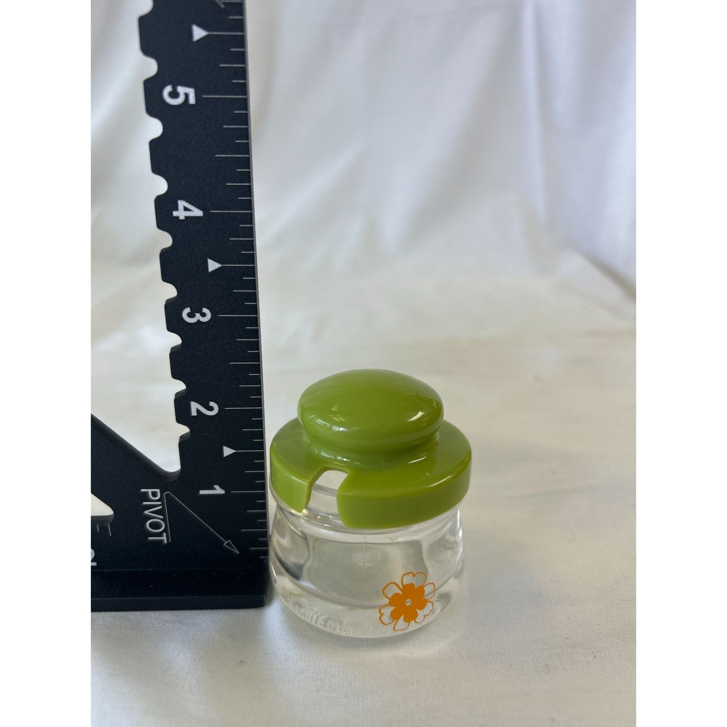 Mini Clear Glass Container With Green Lid & Orange Daisy Decoration